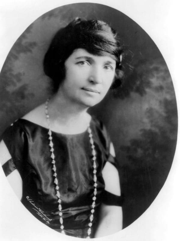 Margaret Sanger portrait, showing a determined woman in early 20th century attire